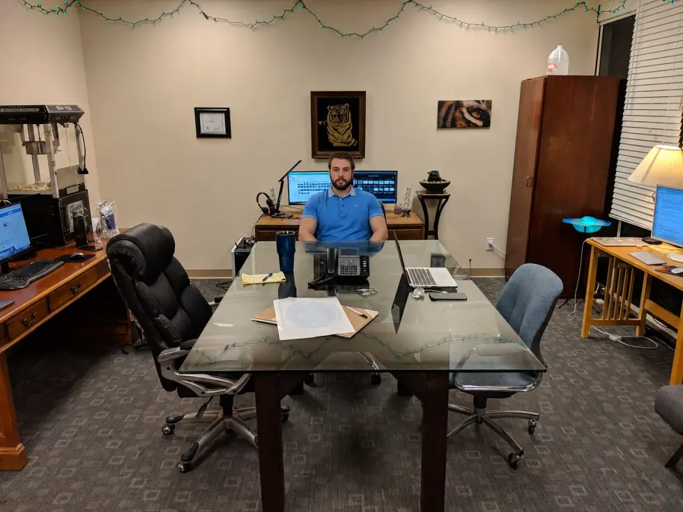 Ramsey Deal at his desk in the first Uptrade Exchange office, 2017